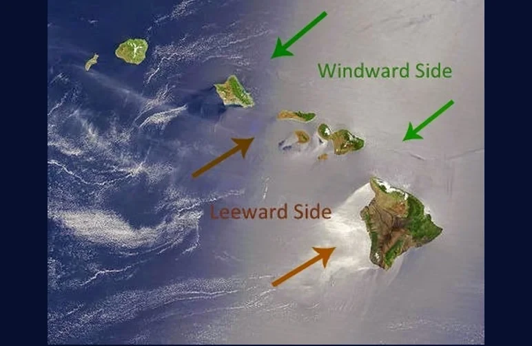 Satellite map of the Hawaiian Islands showing the meteorological difference between the humid Windward sides and the dry Leeward sides to help cannabis growers choose the right strains.